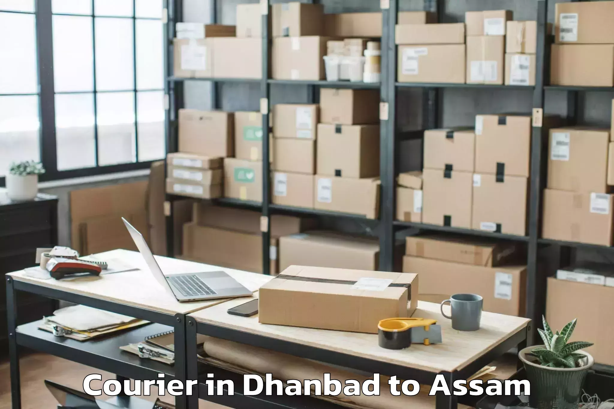 Book Dhanbad to Sualkuchi Courier